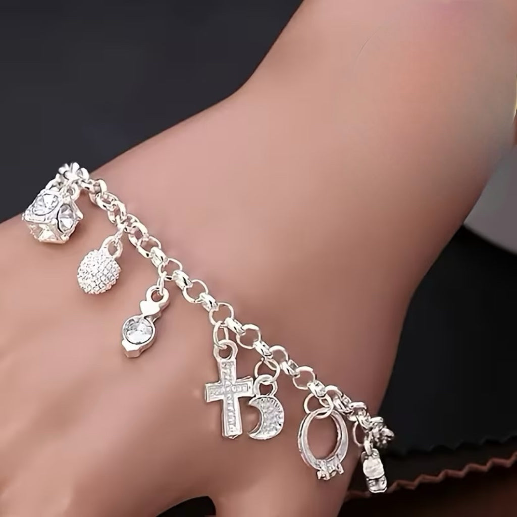Stainless steel charm bracelet with 18 charms