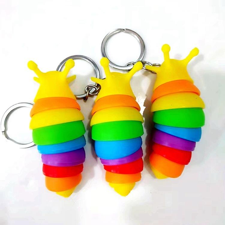 Movable fidget slug keyring.