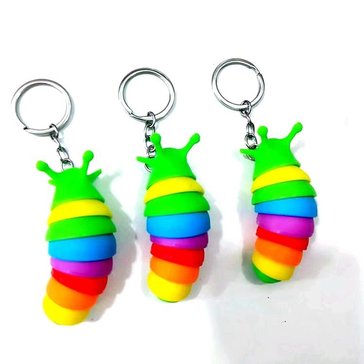 Movable fidget slug keyring.