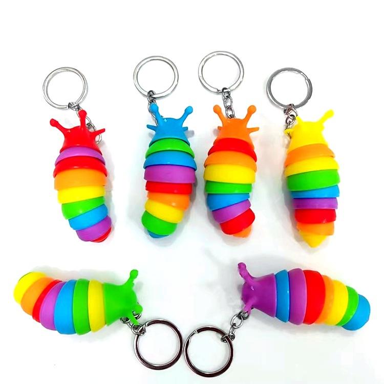 Movable fidget slug keyring.