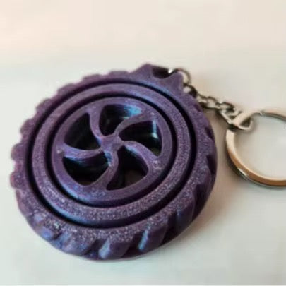 wheel shaped middle 3d printed fidget keyring.