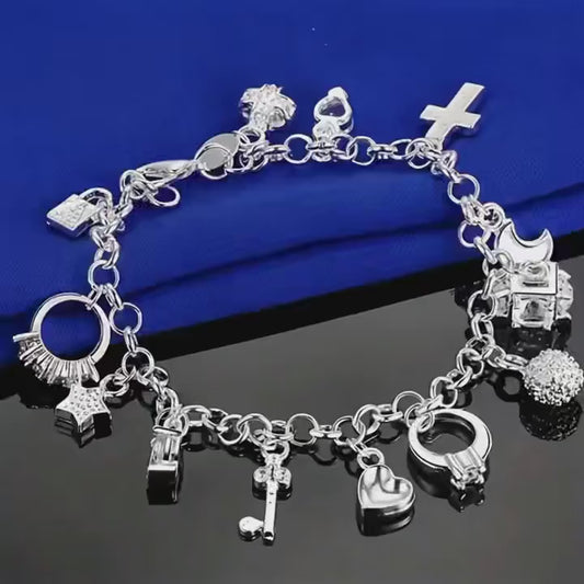 Stainless steel charm bracelet with 18 charms